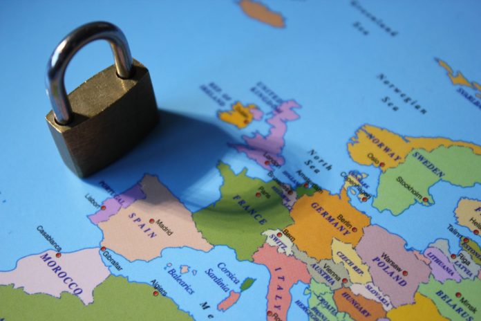 Lockdown coronavirus covid-19 virus concept padlock lock shadow across Europe including Spain, Italy, UK, France, germany, greece, poland, ukraine and rest